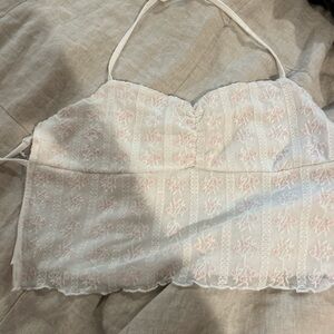 white top with pink flower tie back